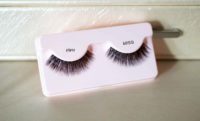 kiss flirty lashes in their packaging